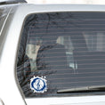 Load image into Gallery viewer, This individual die-cut sticker features a blue treble clef with a paint splattered background. Perfect for performers and music lovers alike! This image shows the treble clef sticker on the back window of a car.