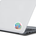 Load image into Gallery viewer, This underwater scene features corals, sand, and a pastel watercolor background on an individual die-cut sticker. With this sticker you can take the reef with you anywhere you go! This image shows the Watercolor Reef sticker on the back of an open laptop.