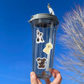 Load image into Gallery viewer, Dog lovers, this sticker sheet is for you! It has sticker images of 16 different dogs plus 2 heart paw stickers. Is your favorite puppy here? This image shows a water bottle with stickers of a French Bulldog puppy, a Poodle puppy, and a lovable dark brown puppy with a white circle around it's right eye.