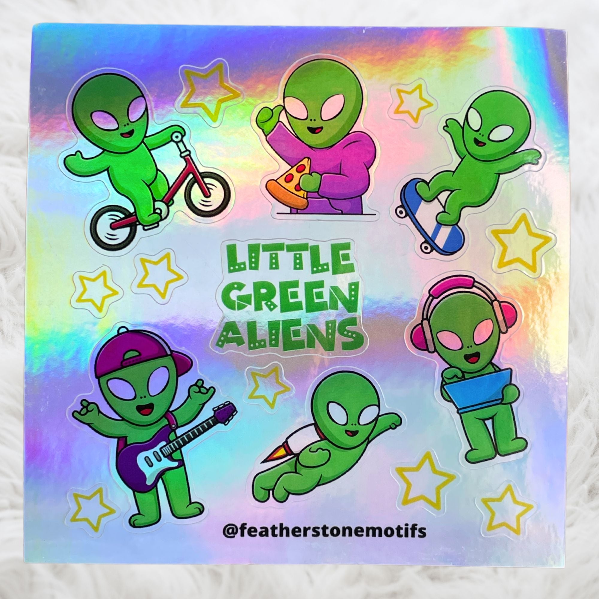 This image shows the Little Green Aliens holographic mini sheet