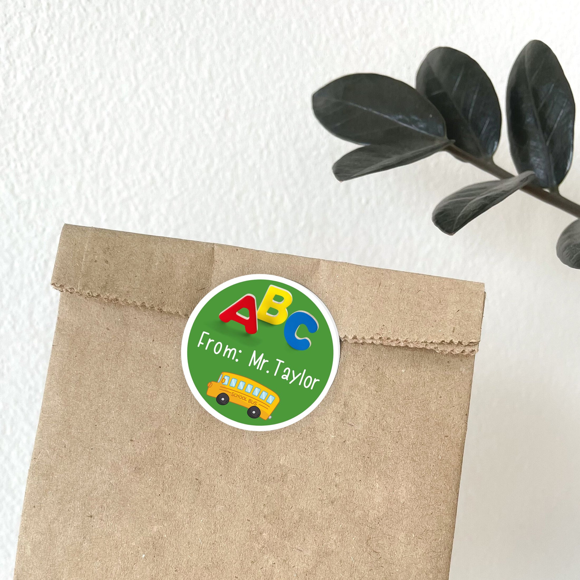 This image shows the personalized school sticker on a paper bag.