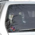 Load image into Gallery viewer, This image show the astronaut surfing sticker on the back window of a car.r
