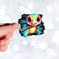Load image into Gallery viewer, This image shows a hand holding the baby sea turtle sticker.
