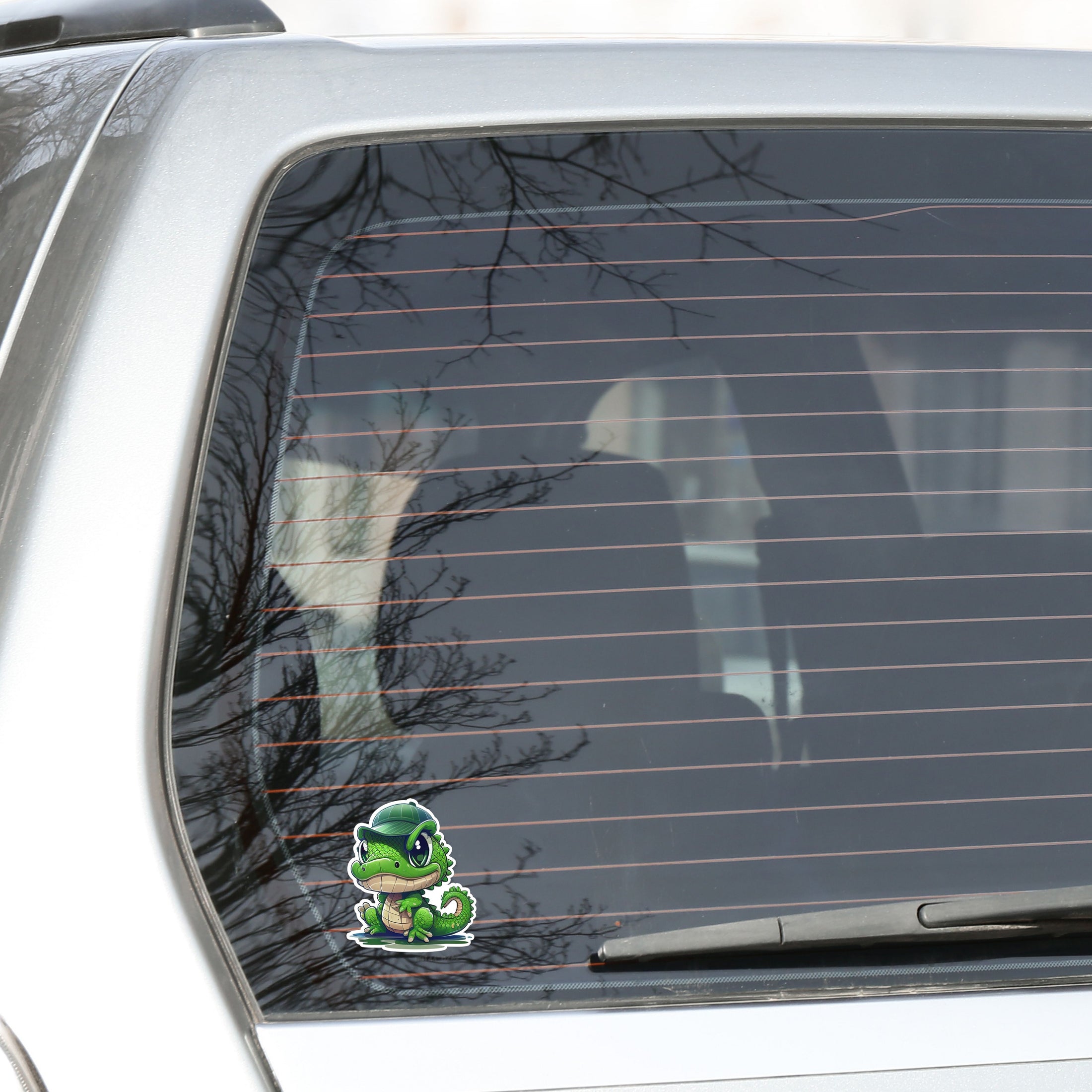 This image shows the crocodile wearing hat sticker on the back window of a car.