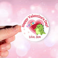 Load image into Gallery viewer, This image shows a hand holding the personalized valentine sticker.
