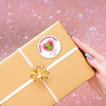 Load image into Gallery viewer, This image shows the valentine sticker on a package.

