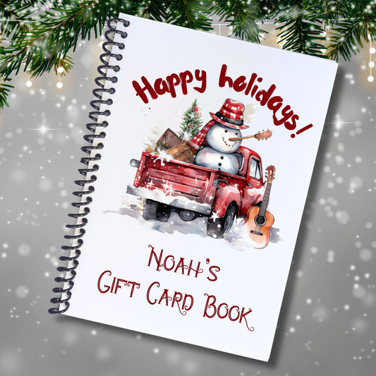 This image shows the cover of the Personalized Christmas Gift Card Book with Stickers and PVC Cover - Pickup Snowman.