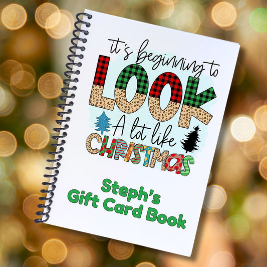 This image shows the cover of the Personalized Christmas Gift Card Book with Stickers and PVC Cover - Beginning to look like Christmas.