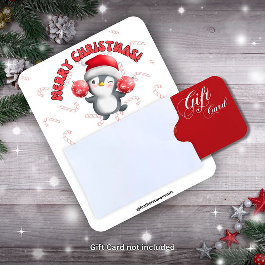 This image shows a gift card partially inside the Christmas Penguin Gift Card Money Card.