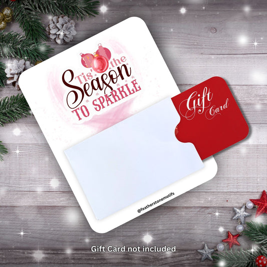 This image shows a gift card partially inside the Season to Sparkle Gift Card Holder Money Card.