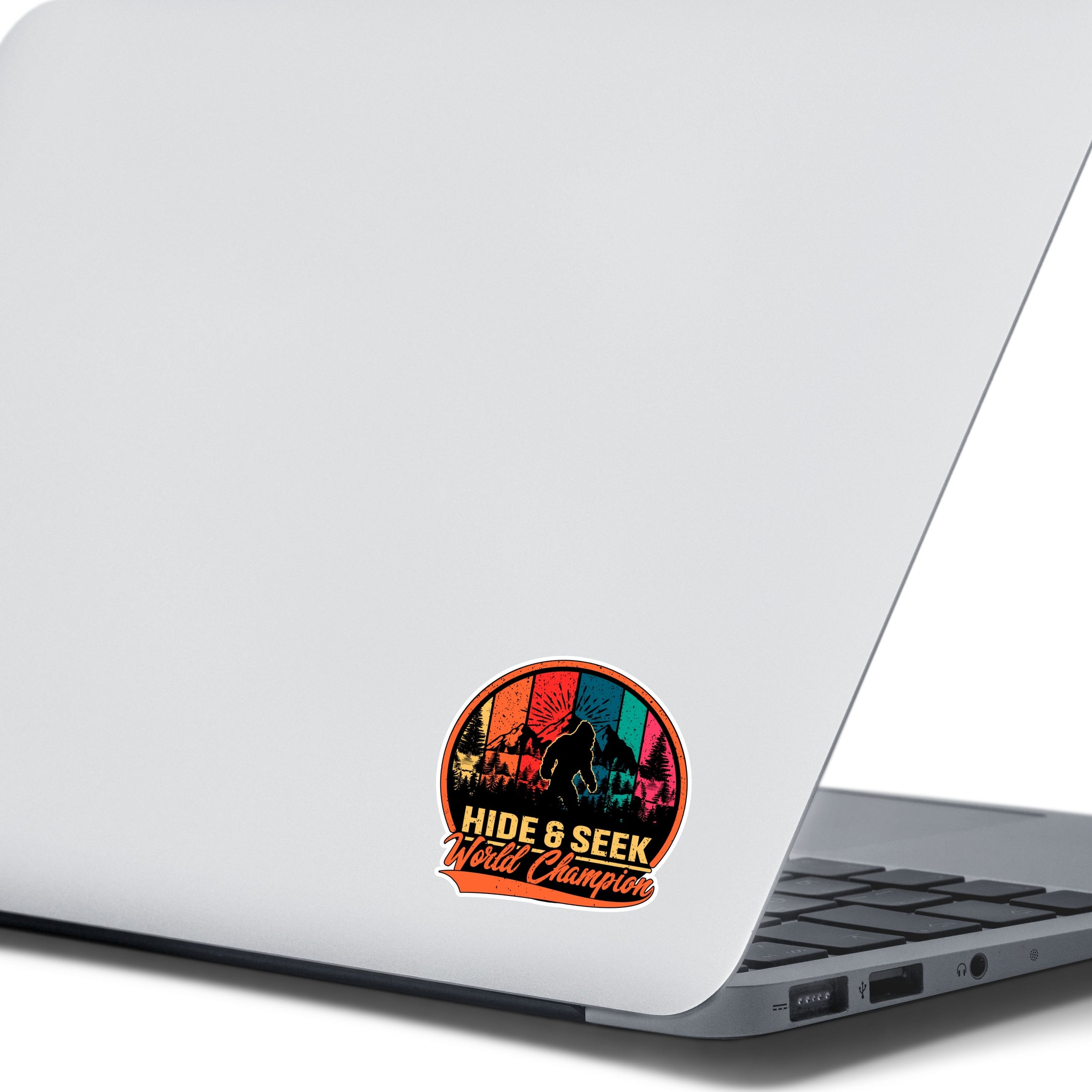 This image shows the hide & seek sticker on the back of an open laptop.