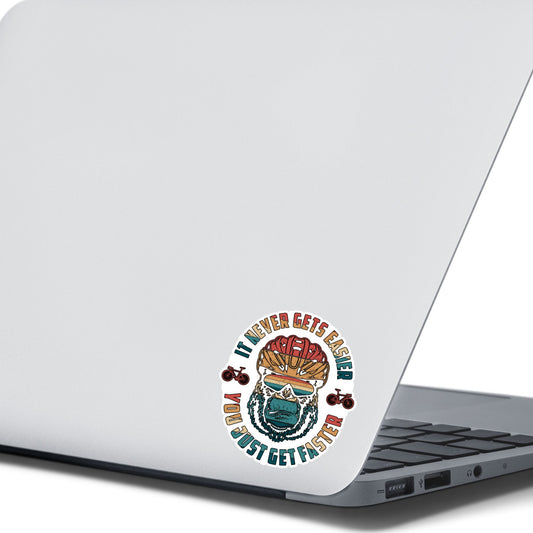 This image shows the Keep Biking - Gorilla Die-Cut Sticker on the back of an open laptop.