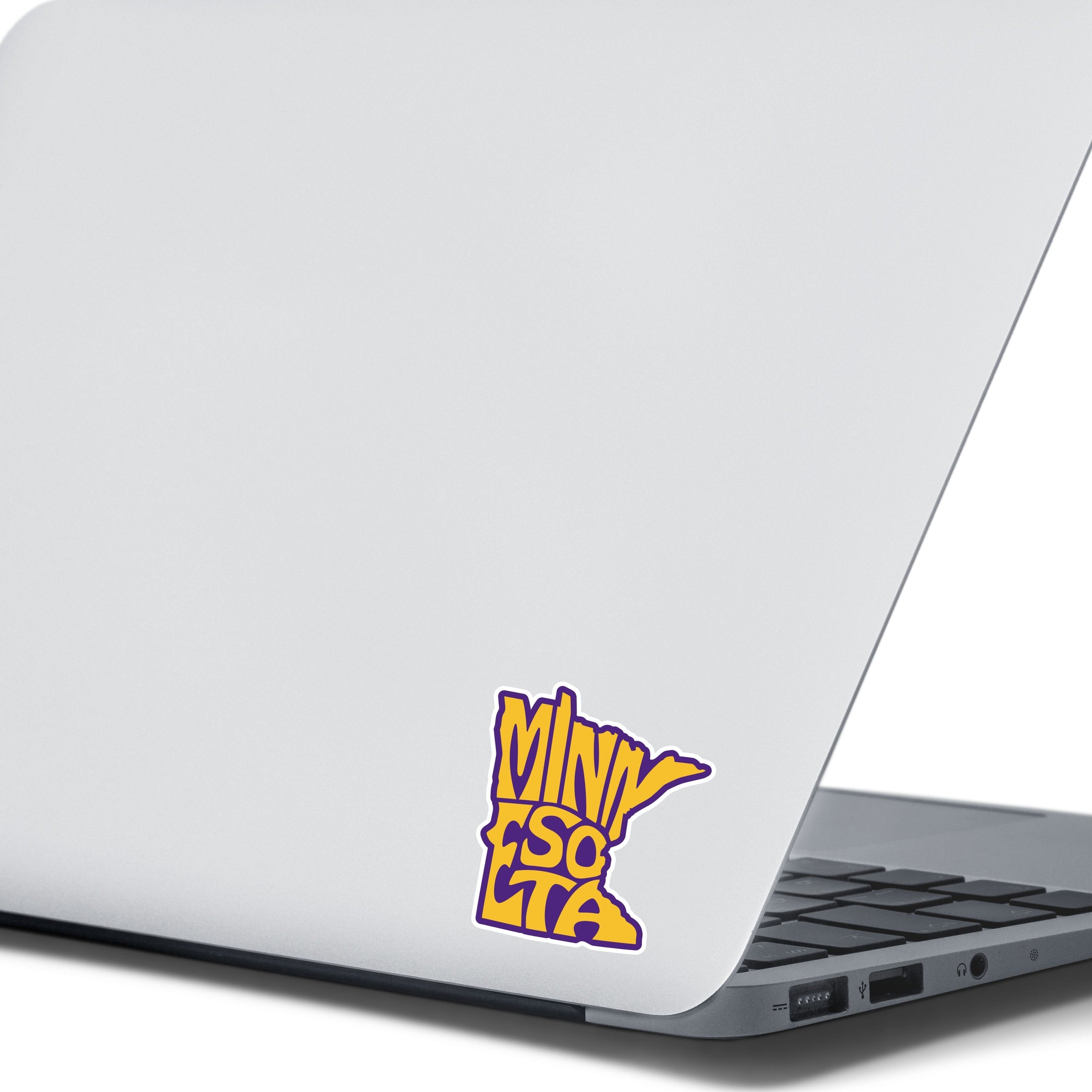 This image show the Minnesota purple and gold sticker on the back of an open laptop.