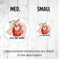 Load image into Gallery viewer, This image shows the medium and small holiday stickers side-by-side for a size comparison, and it says “Approximate dimensions are listed in the description.
