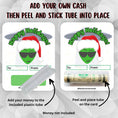 Load image into Gallery viewer, This image show how to attach the money tube to the Alien Holidays money card.
