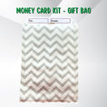 Load image into Gallery viewer, This image show a money card inside the included gift bag.
