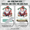 Load image into Gallery viewer, This image shows how to apply the money tube to the Santa Christmas money card.
