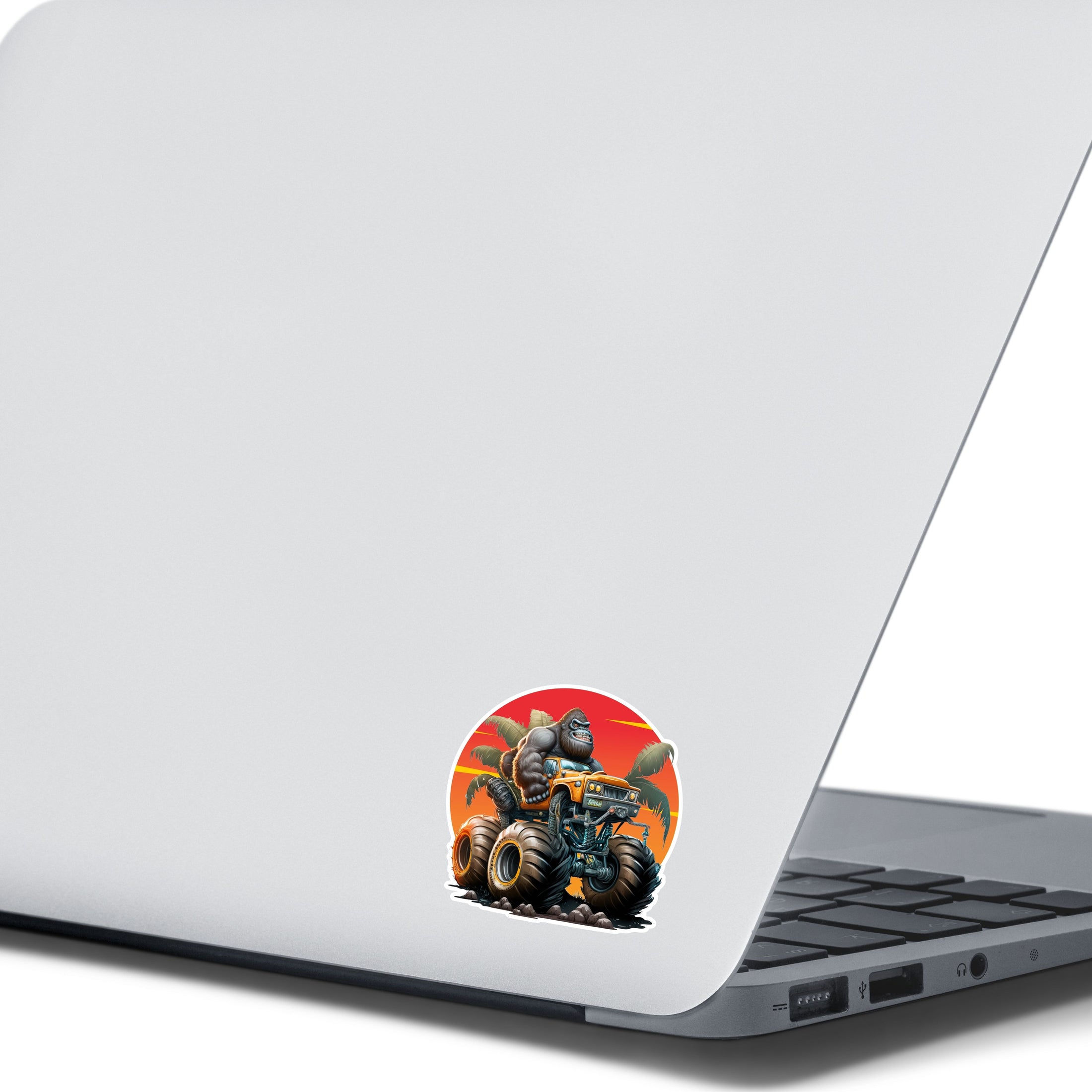 This image shows the gorilla monster truck sticker on the back of an open laptop.
