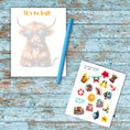 Load image into Gallery viewer, This image shows the notepad, a randomly chosen color (blue) pen, and paper sticker/label sheet that is available as part of the No Bull Cruise Magnet Accessories.
