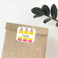 Load image into Gallery viewer, This image shows the personalized school sticker on a paper bag.

