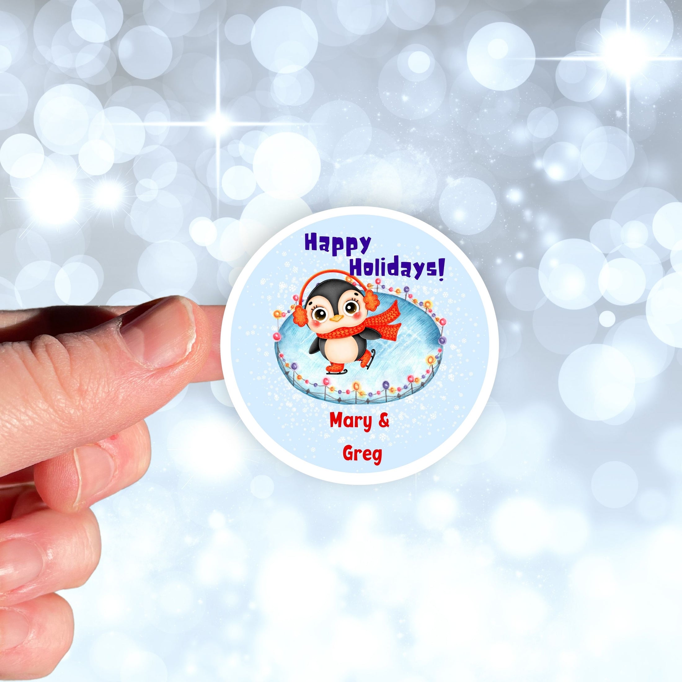 This image shows the personalized holiday sticker being held on one finger over a background of bubbles.