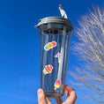 Load image into Gallery viewer, This image shows a water bottle with some of the Picnic stickers applied.
