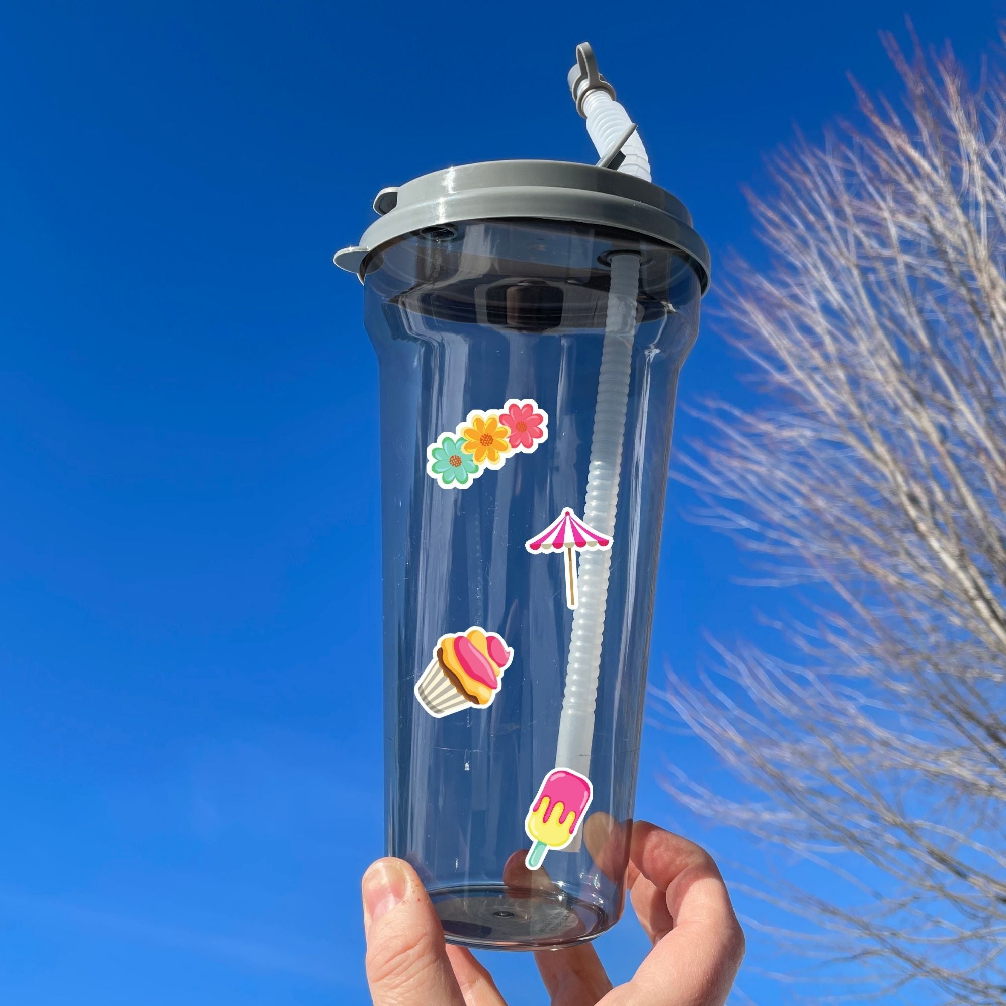 This image shows a water bottle with some of the Picnic stickers applied.