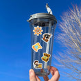 Load image into Gallery viewer, This image shows a water bottle with some of the pirate stickers applied.
