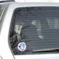 Load image into Gallery viewer, This image shows the gnome with a popsicle on the back window of a car.
