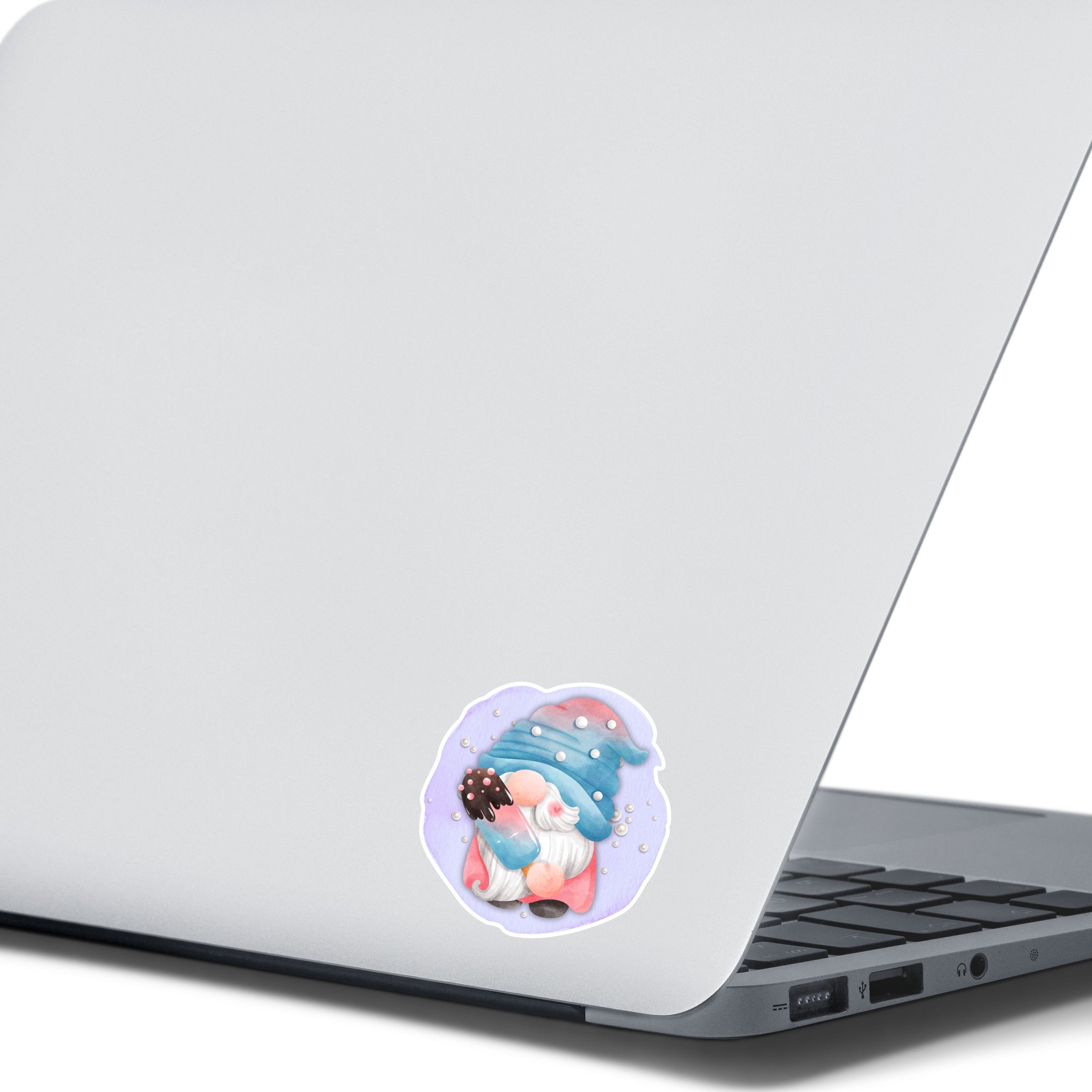 This image shows the gnome with a popsicle on the back of an open laptop.