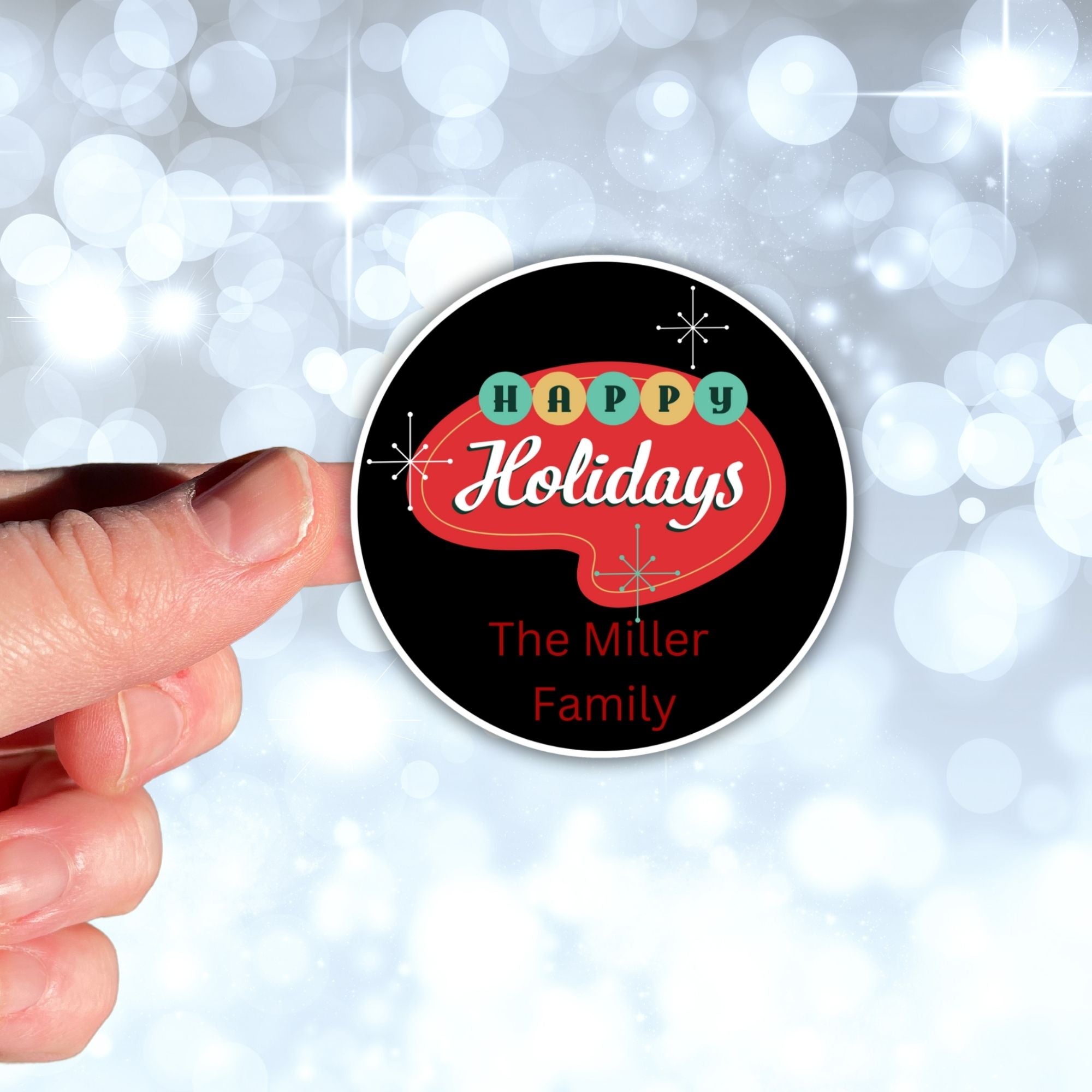 This image shows a hand holding the Personalized Holiday Stickers - Retro Holidays.