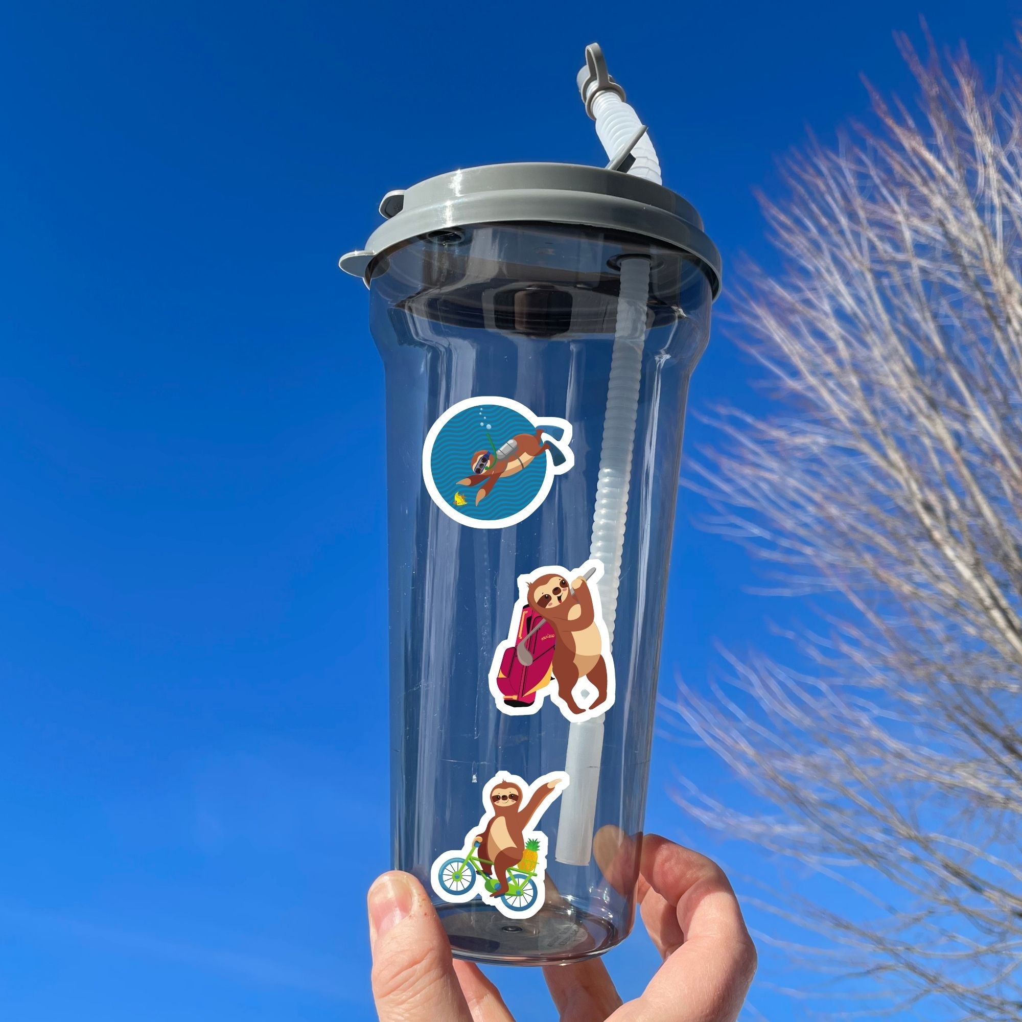 This image shows a water bottle with some of the Sloth Party! stickers applied.