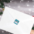 Load image into Gallery viewer, This image shows the Personalized Holiday Stickers - Snowman Family Holiday on the back of an envelope.
