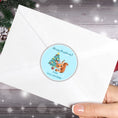 Load image into Gallery viewer, This image shows the Personalized Holiday Stickers - Squirrel Christmas on the back of an envelope.
