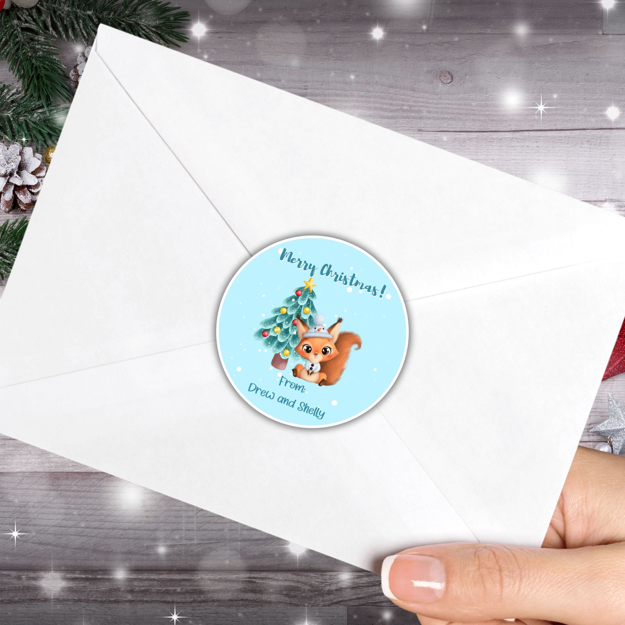 This image shows the Personalized Holiday Stickers - Squirrel Christmas on the back of an envelope.