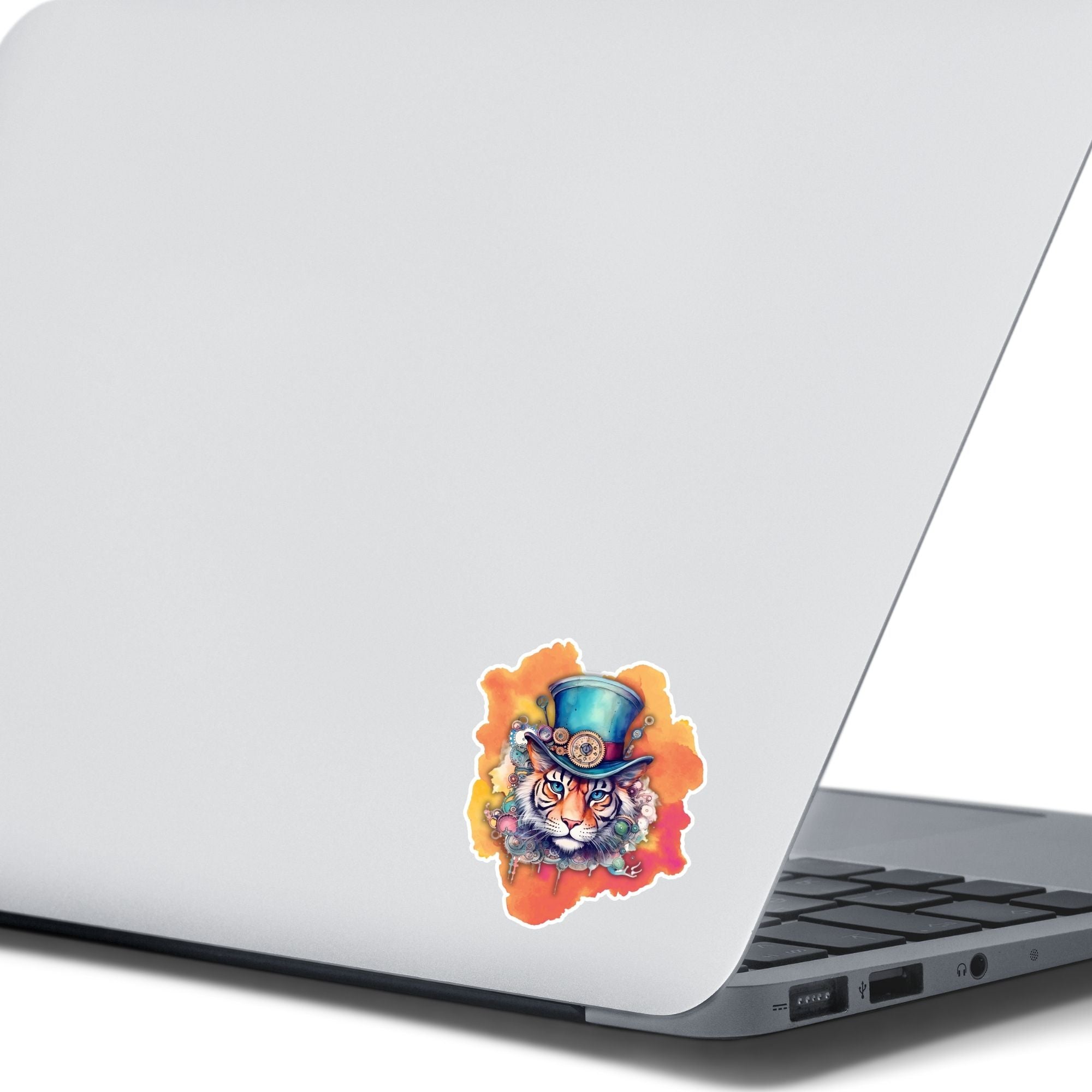 This image shows the Steampunk Tiger Die-Cut Sticker on the back of an open laptop.