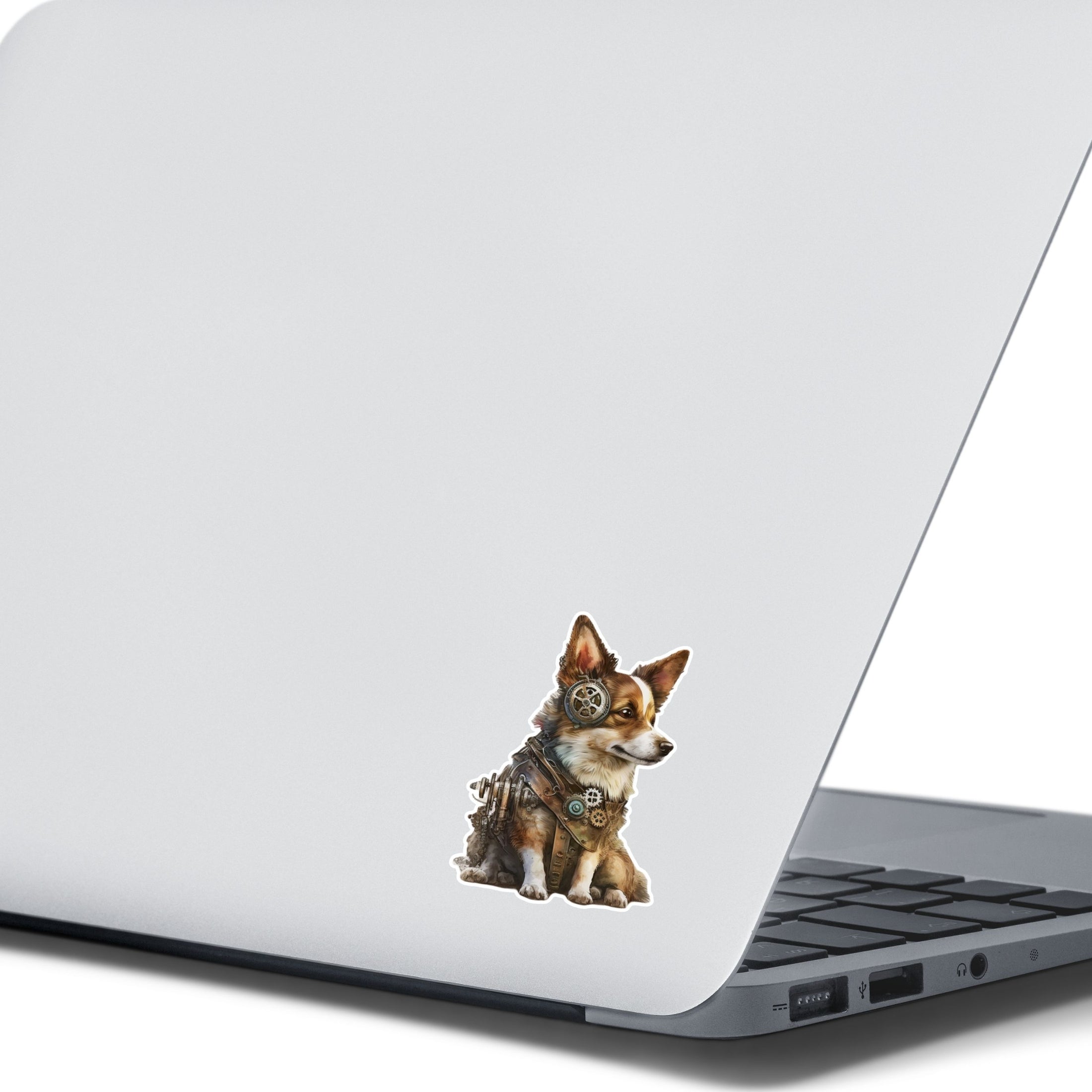This image shows the steampunk puppy sticker on the back of an open laptop.