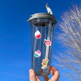Load image into Gallery viewer, This image shows a water bottle with some of the Sweet Fun! stickers applied.
