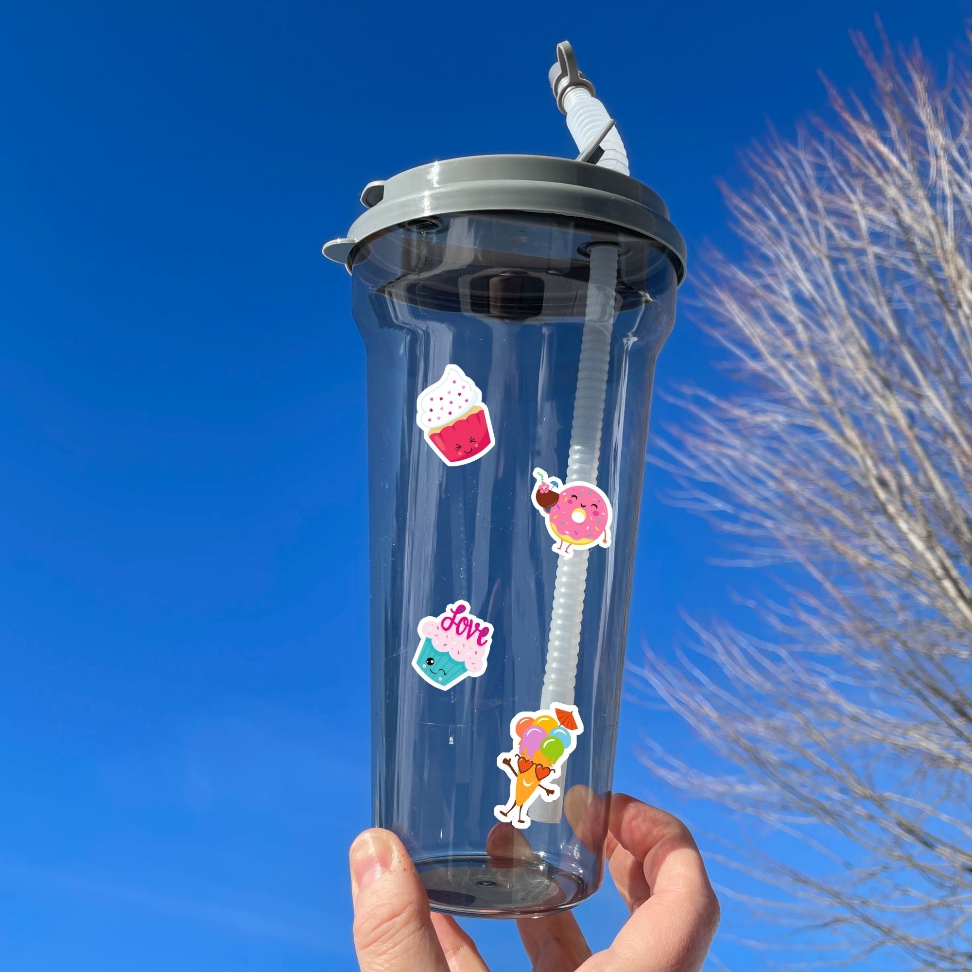 This image shows a water bottle with some of the Sweet Fun! stickers applied.