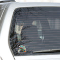 Load image into Gallery viewer, This image shows the toy train sticker on the back window of a car.
