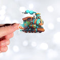 Load image into Gallery viewer, This image shows a hand holding the toy train sticker.
