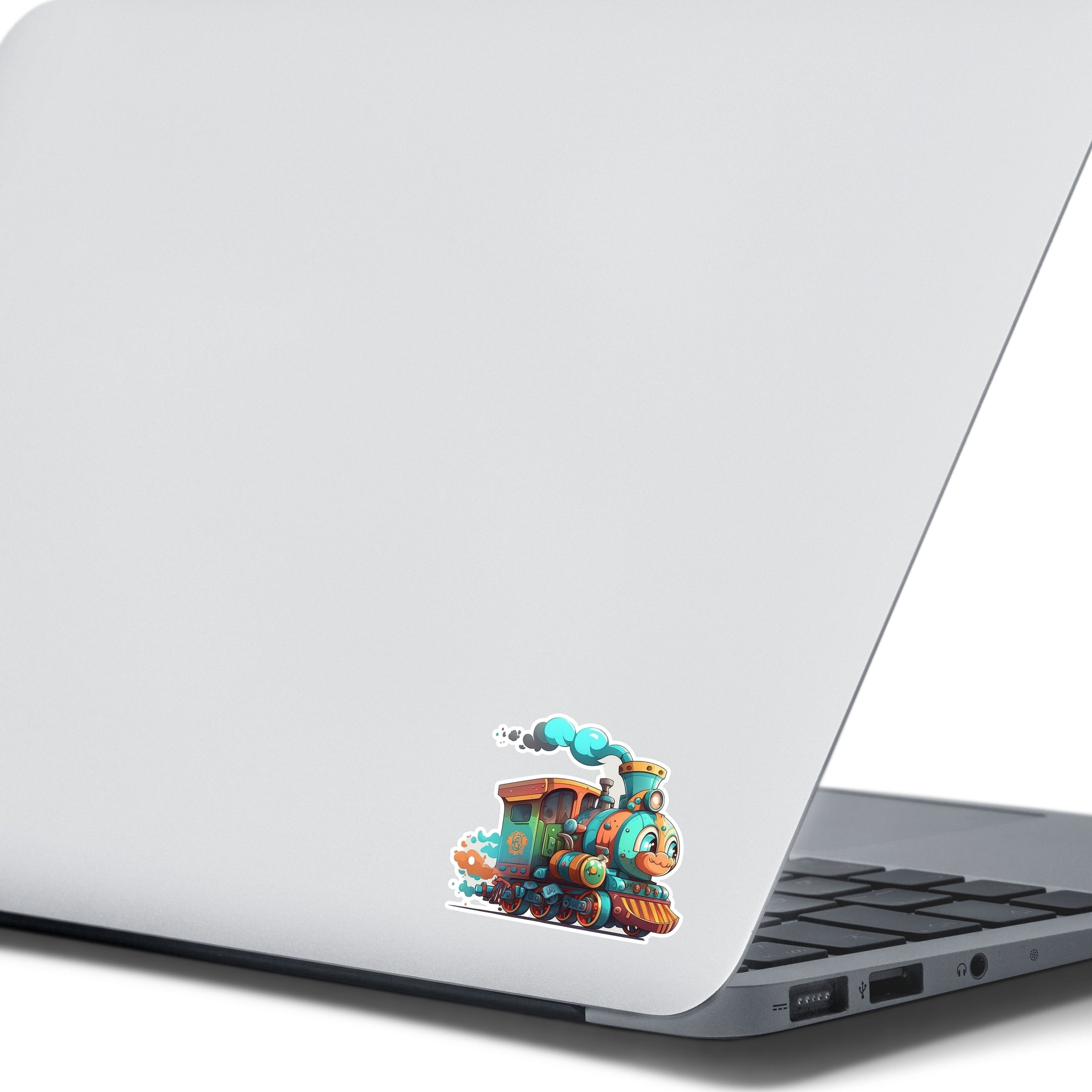 This image shows the toy train sticker on the back of an open laptop.