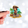 Load image into Gallery viewer, This image shows a hand holding the Pirate Boy Die-Cut Sticker.
