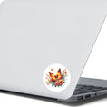 Load image into Gallery viewer, This image shows the Orange Butterfly with Stars Die-Cut Sticker on the back of an open laptop.
