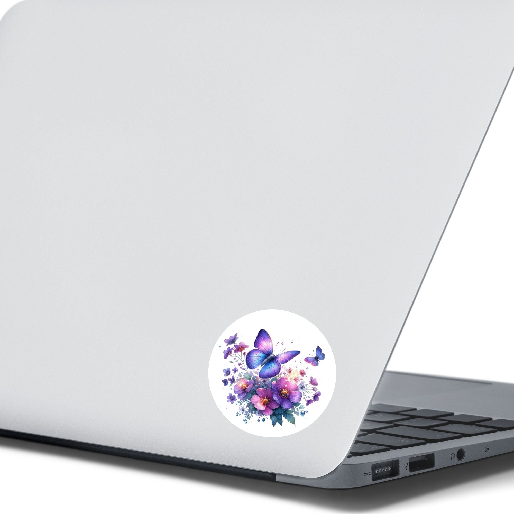 This image shows the Purple Butterfly Die-Cut Sticker on the back of an open laptop.