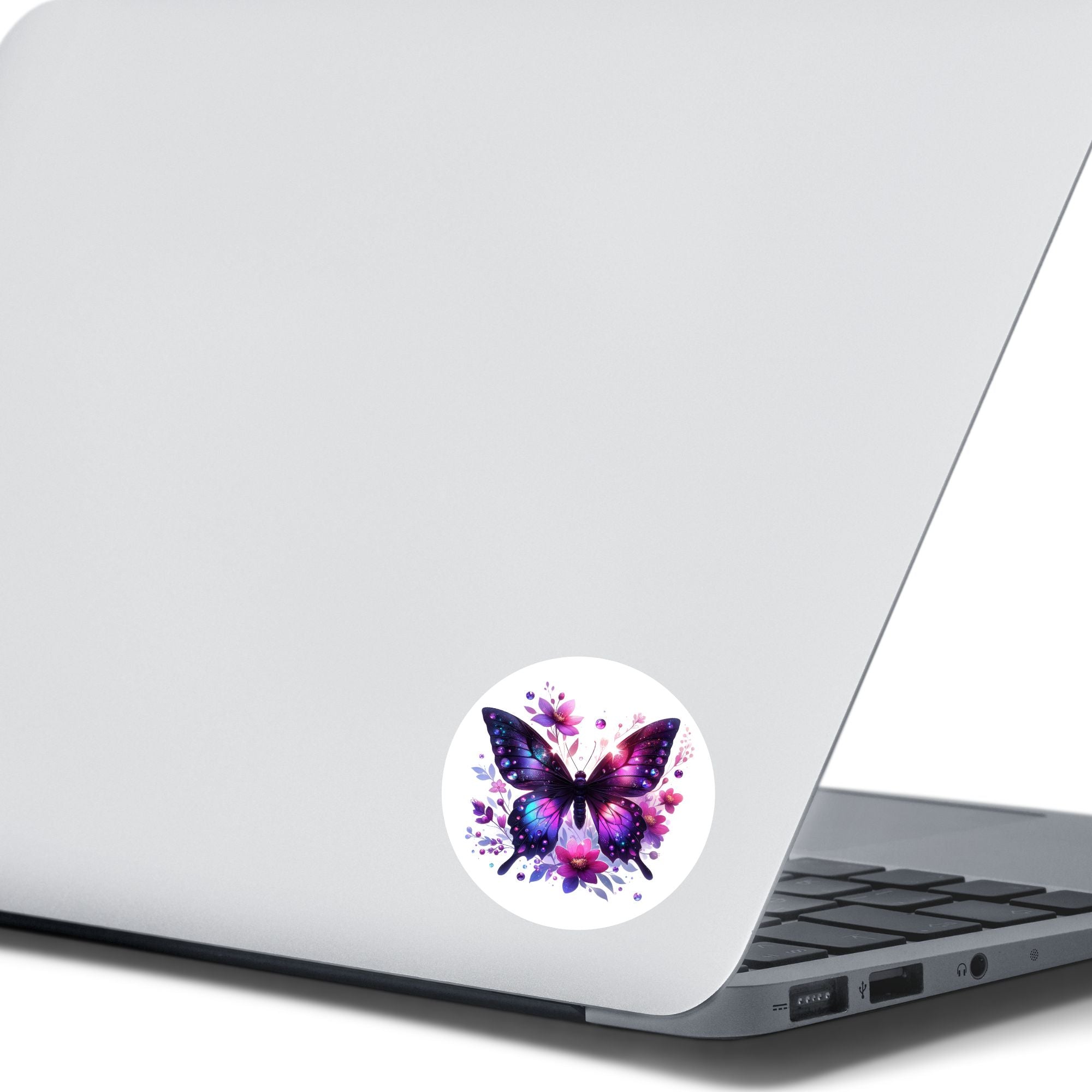 This image shows the Purple Butterfly with Stars die cut sticker on the back of an open laptop.