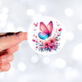 Load image into Gallery viewer, This image shows a hand holding the Pink and Blue Butterfly Die-Cut Sticker.
