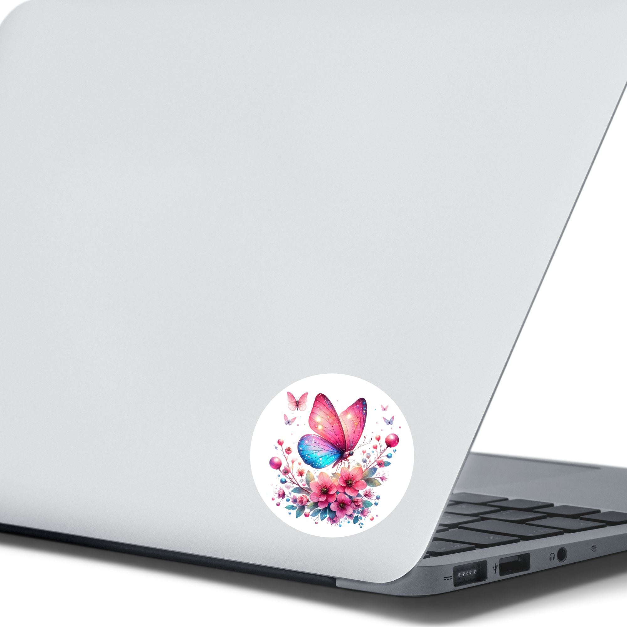 This image shows the Pink and Blue Butterfly Die-Cut Sticker on the back of an open laptop.