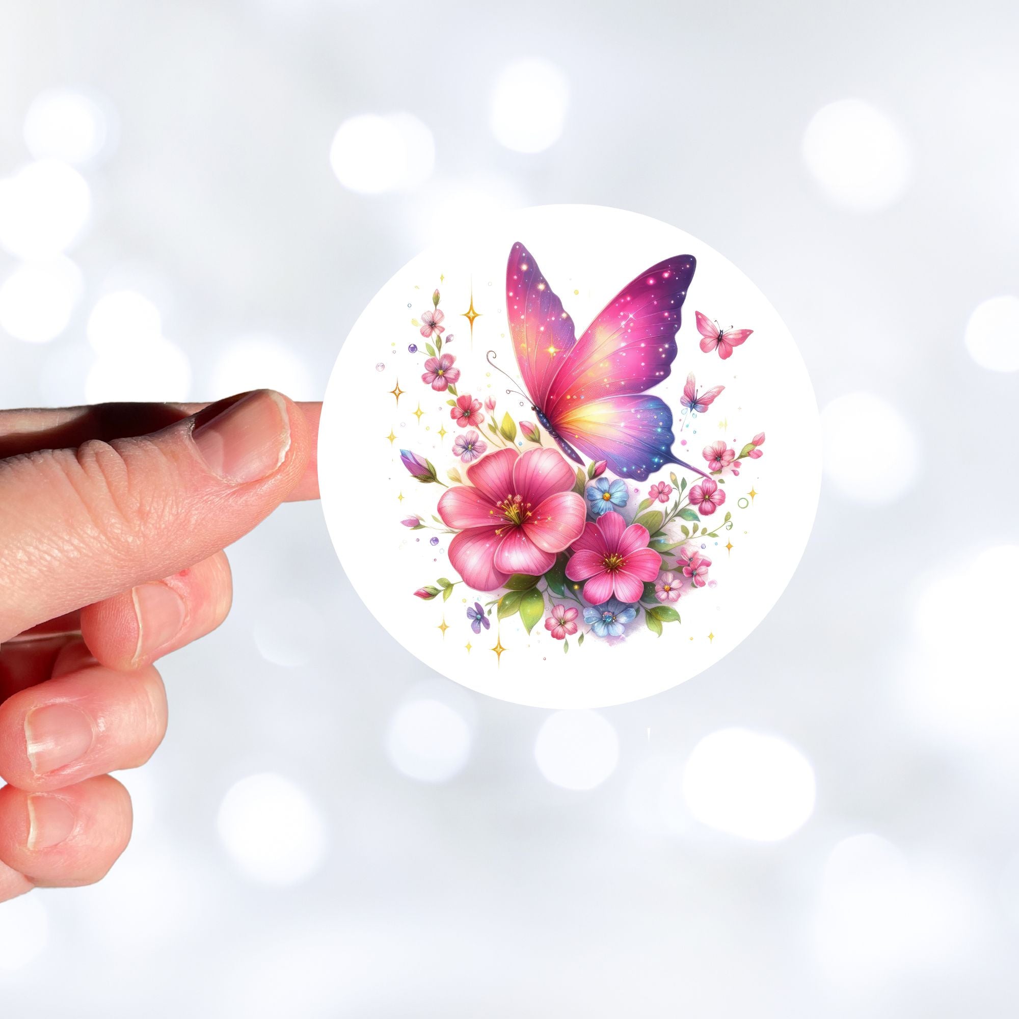 This image features a hand holding the Pink Butterfly with Stars Die-Cut Sticker.