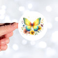 Load image into Gallery viewer, This image shows a hand holding the Yellow Butterfly Die-Cut Sticker.
